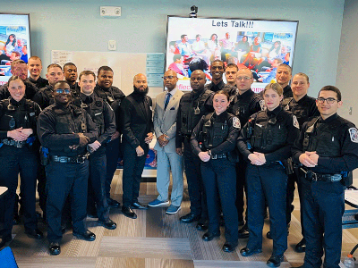 Police academy cadets in a classroom with professor.