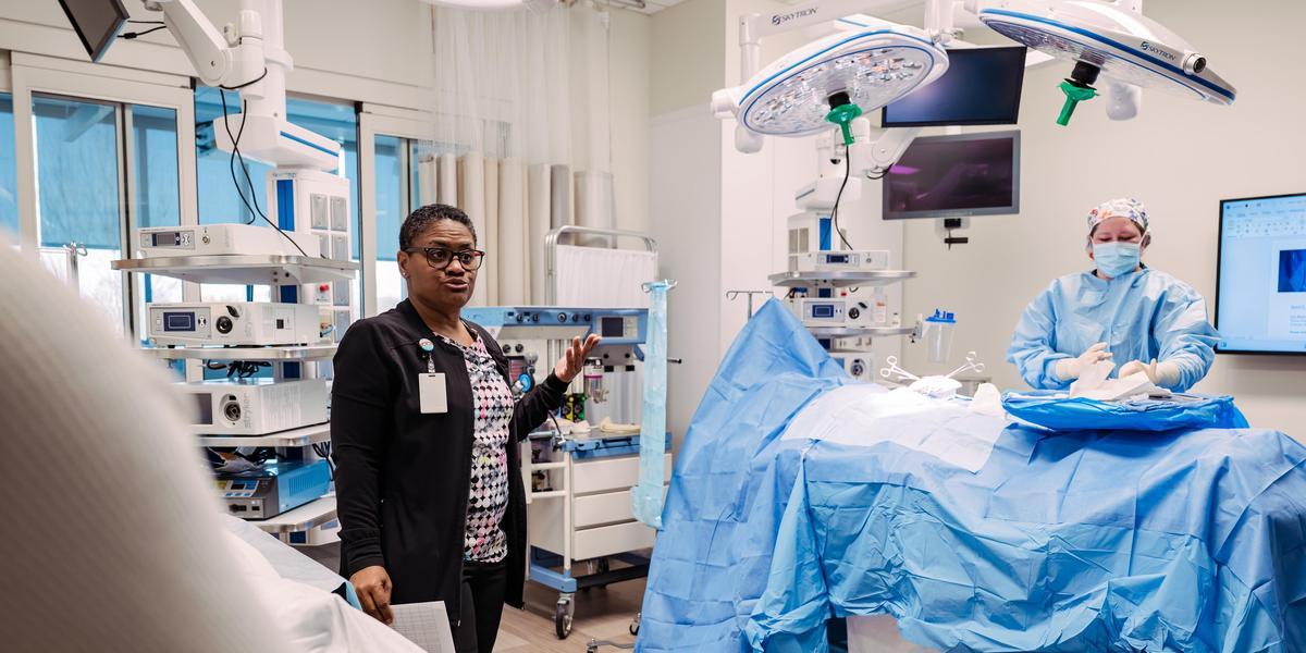 A professor demonstrating surgical technology
