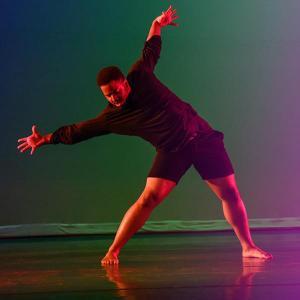 AACC dancer performs on stage.