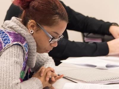 Student studies at her desk.