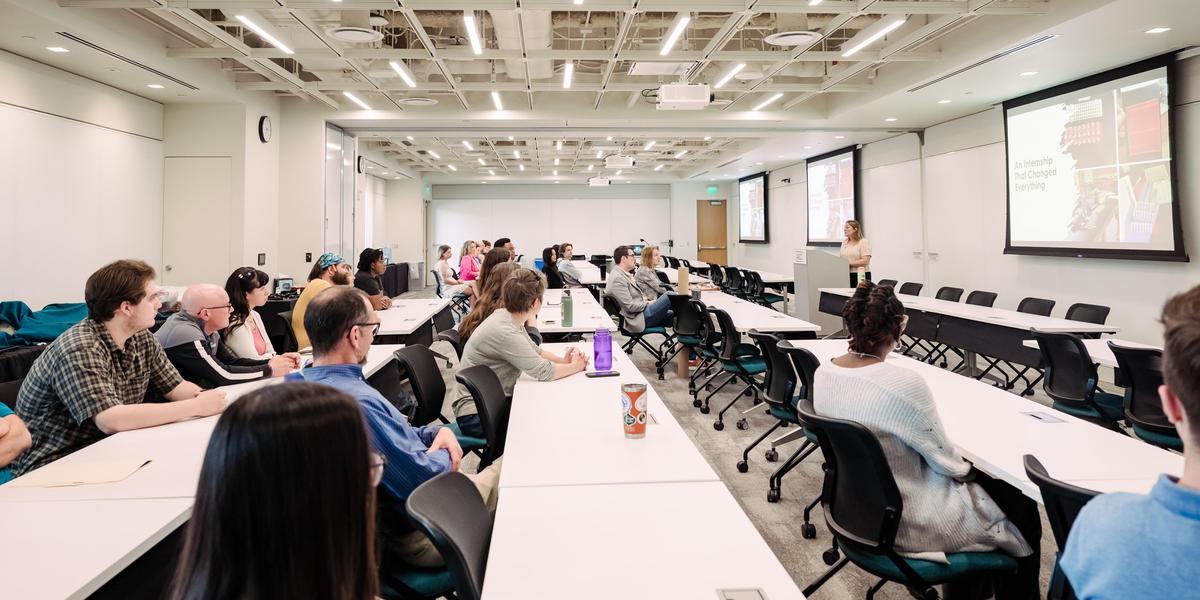 Students watching instructor's presentation.