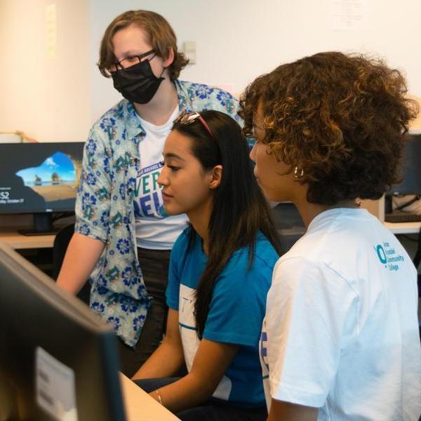 Students looking at computer.