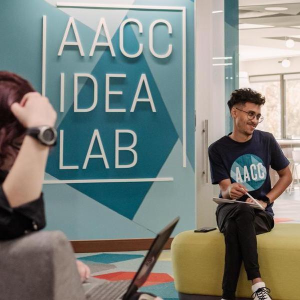 Students sitting outside IDEA Lab.