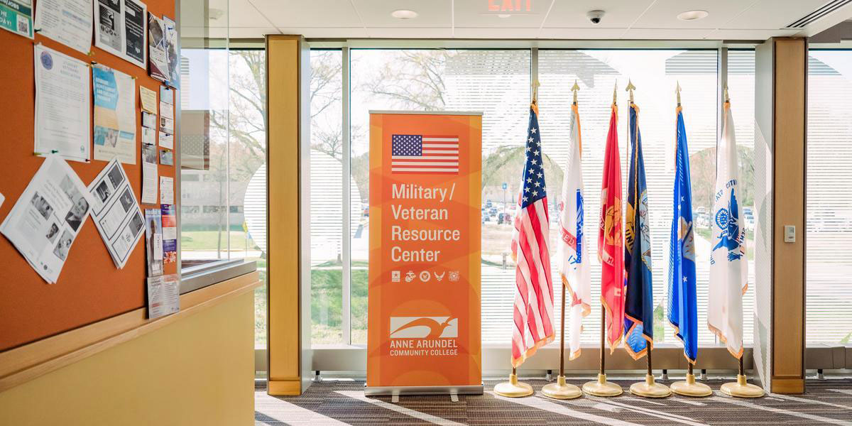 Military Veteran Resources Center banner next to American flag and military branch flags.