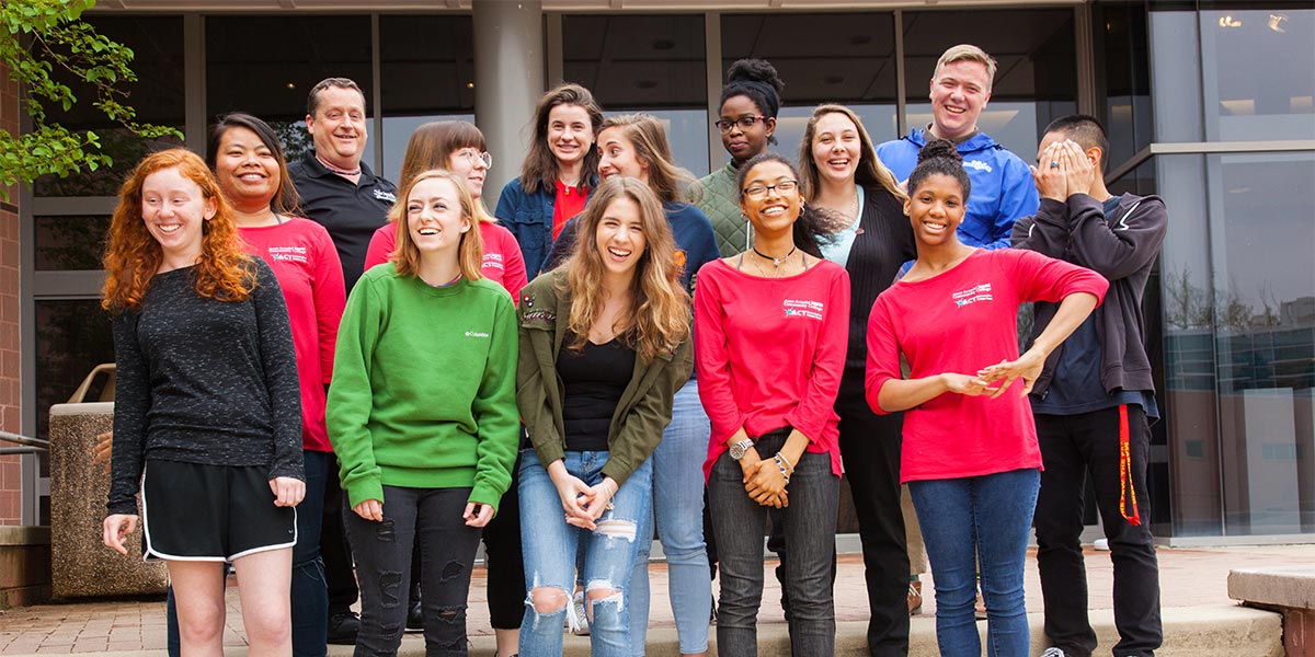Ambassadors pose and laugh.